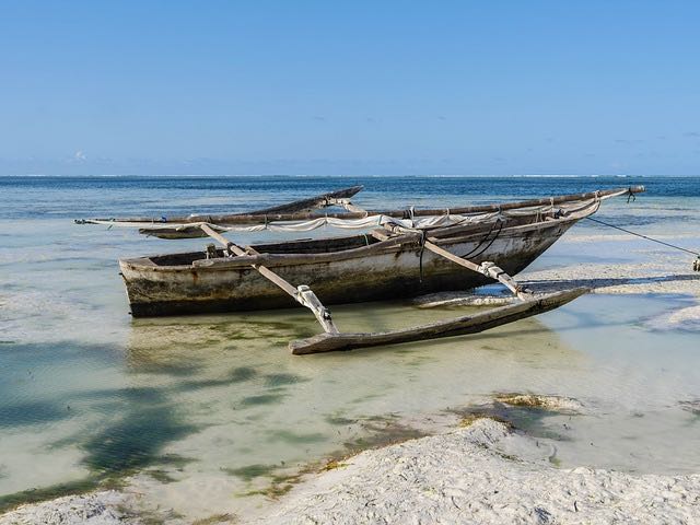 An old-school boat with outriggers